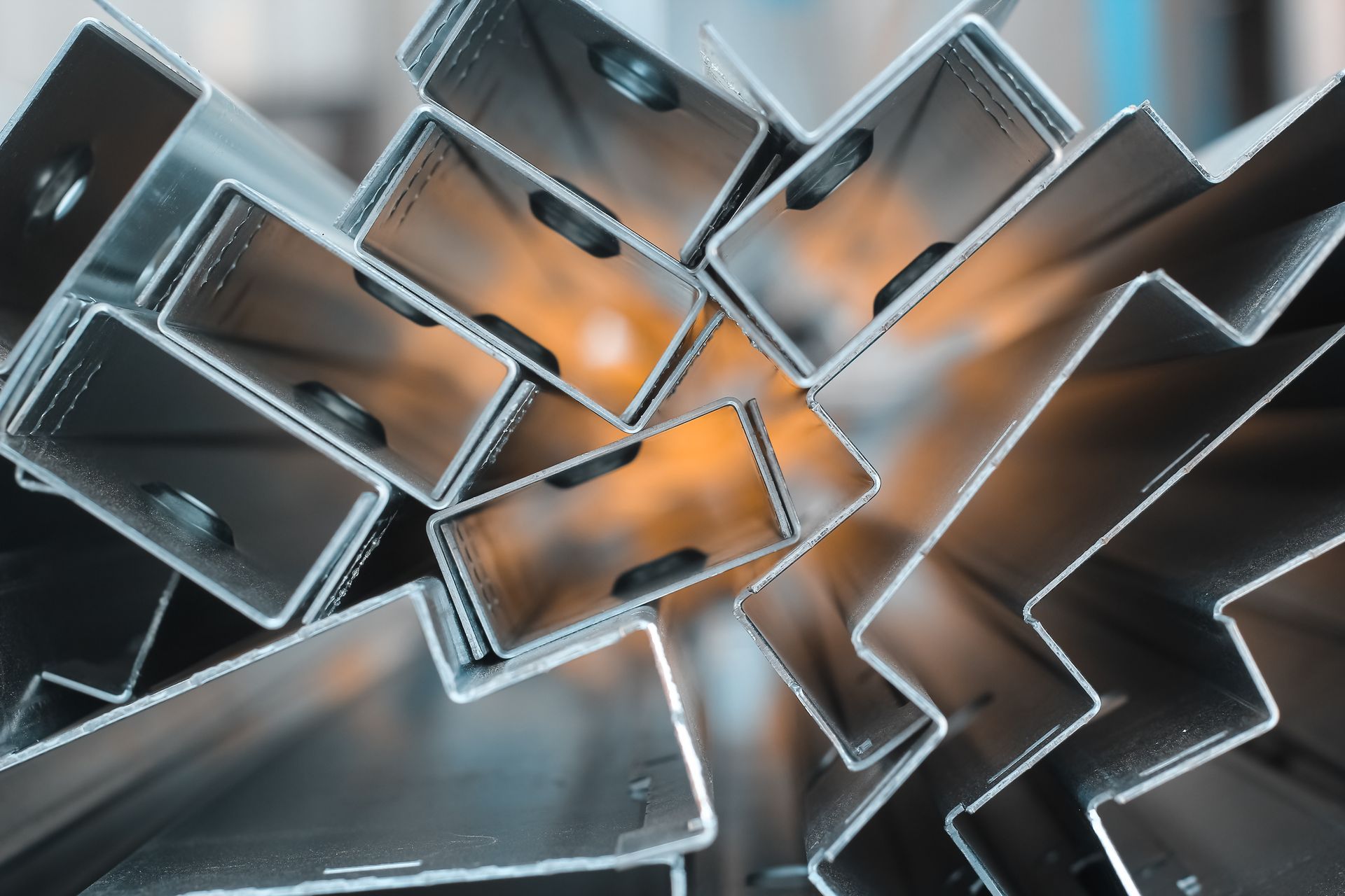 Stacked steel angle and channel pieces for metal fabrication. Stacked steel angle and channel pieces for metal fabrication.