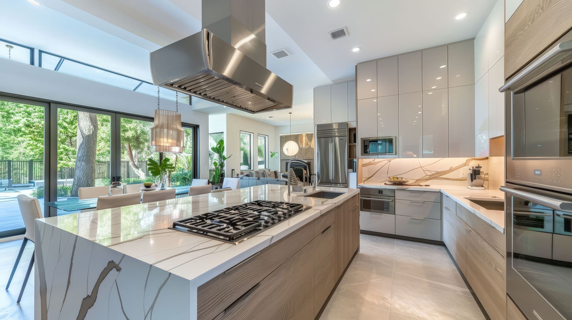 A modern kitchen with stainless steel appliances and a large island.