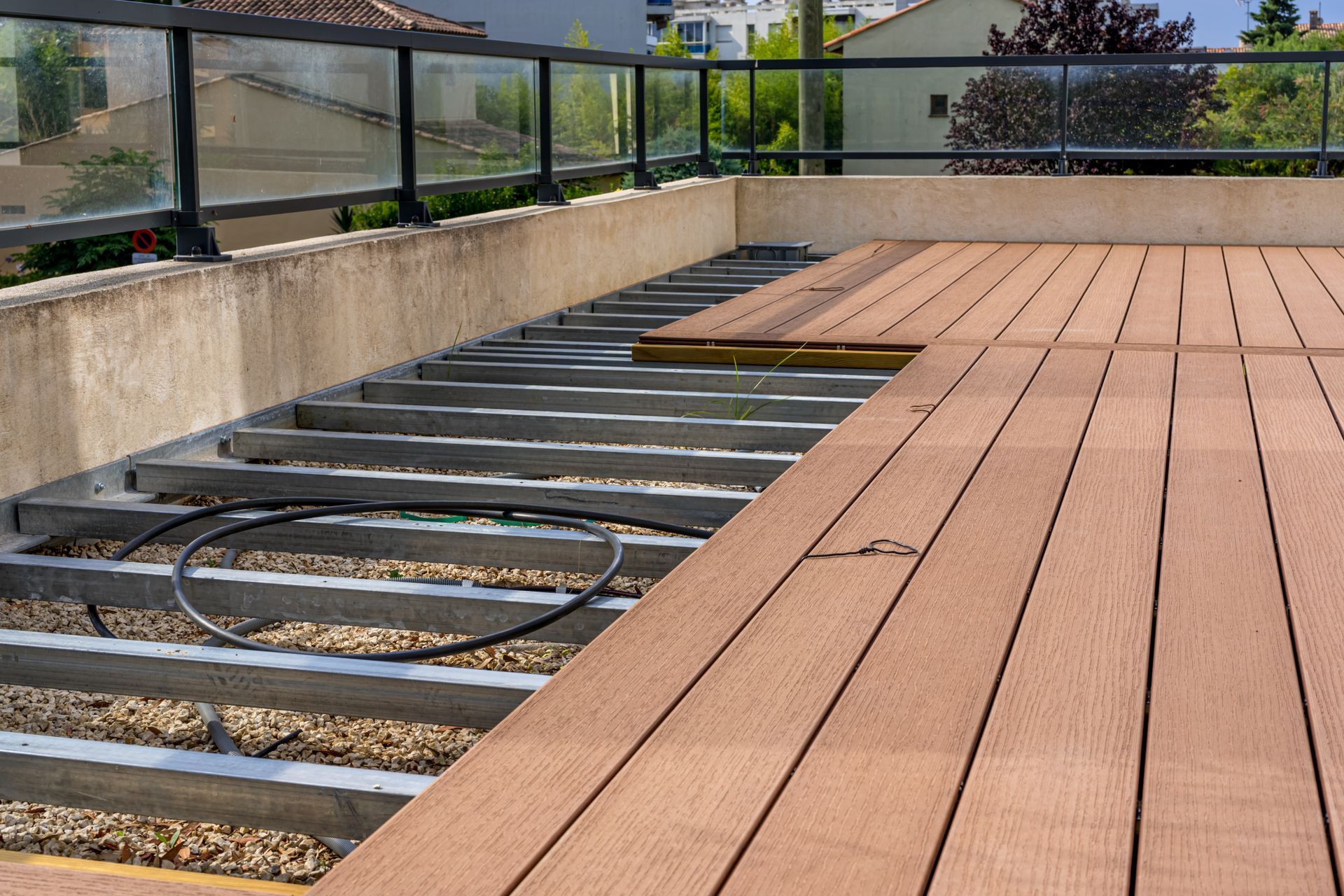 A wooden deck is being built on the roof of a building.