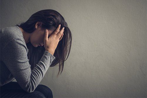 Depressed Woman In Dark Room