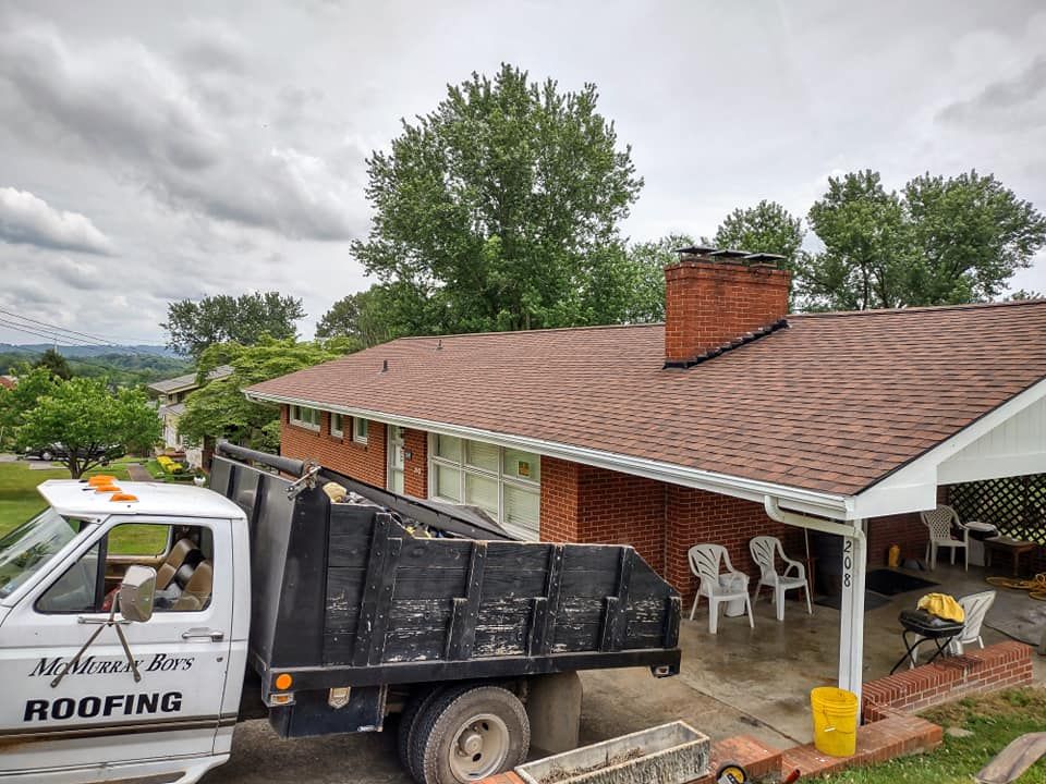 Dump Truck in Front of the House — Kingsport, TN — McMurray Boy's Roofing