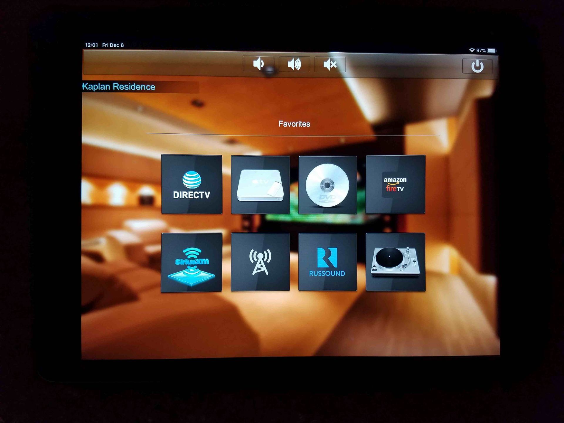 A tablet with a picture of a living room on it