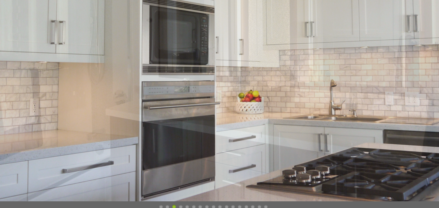 A kitchen with a sink and stove.