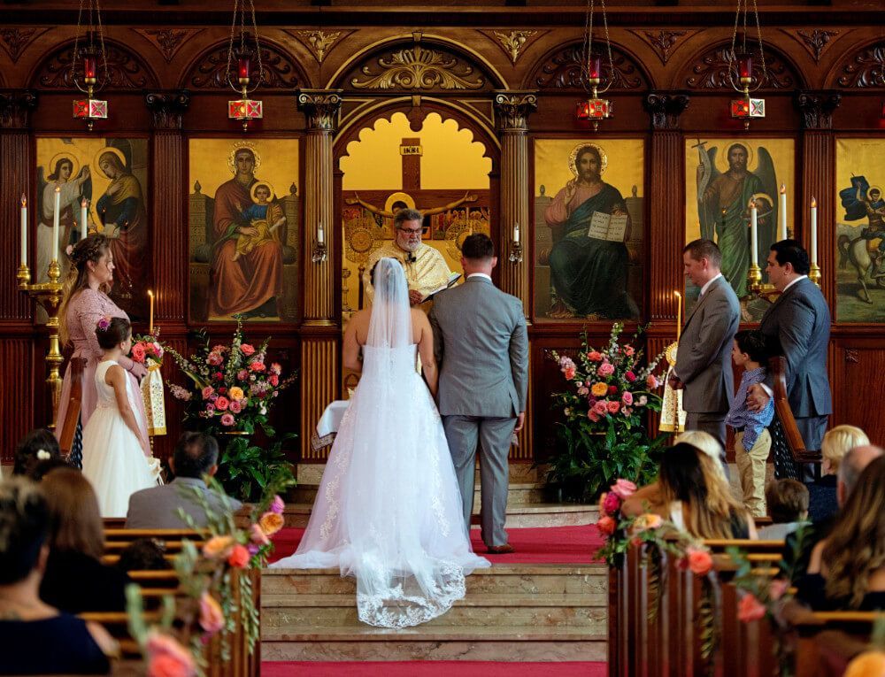 A bride and groom are getting married in a church