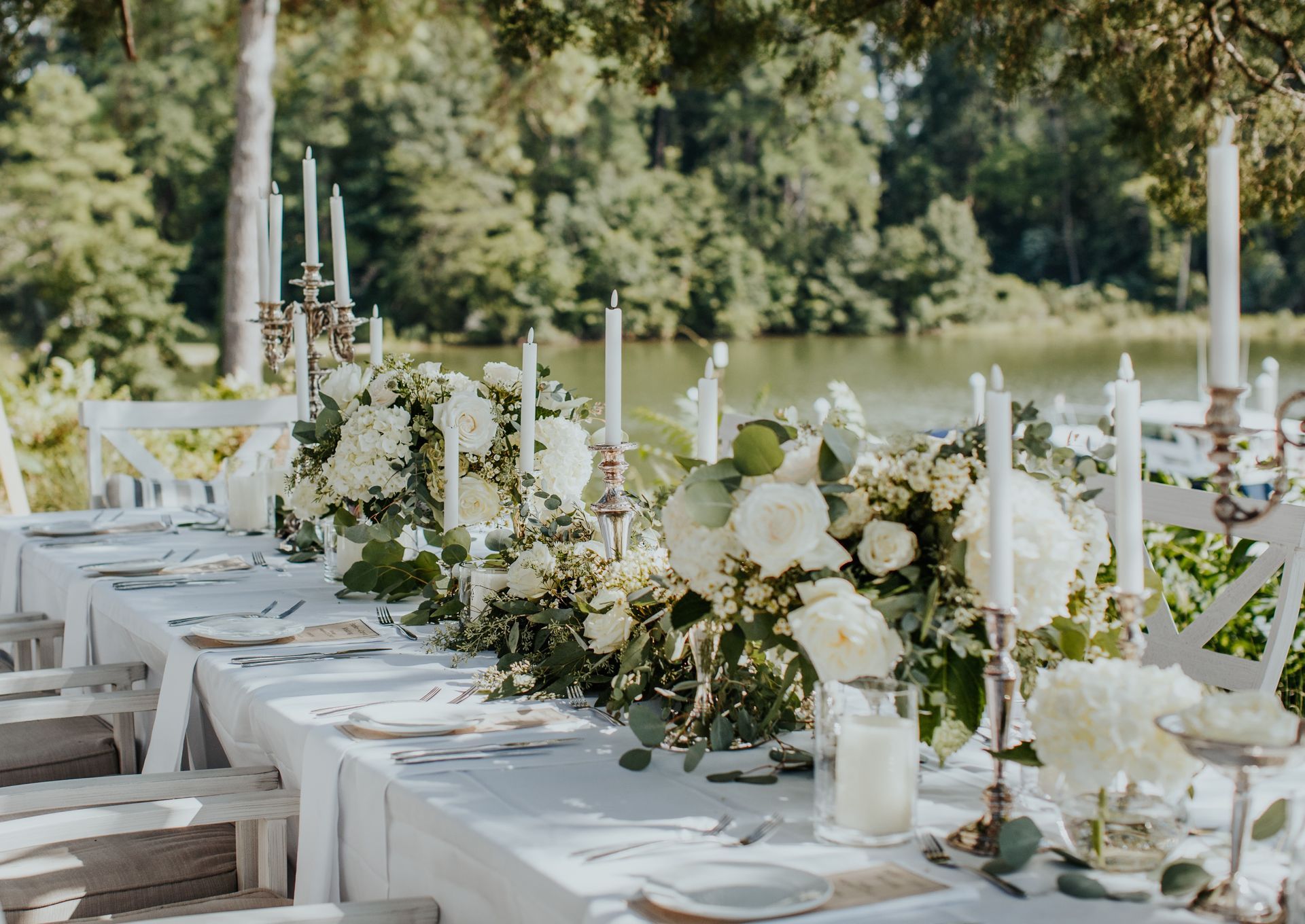 A reserved sign is attached to a chair with flowers.