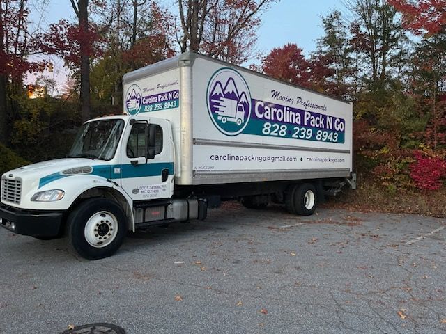 White and teal moving truck with 