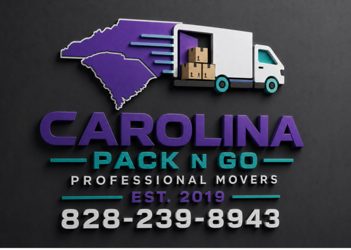 Two men in purple shirts carrying a large wooden cabinet off a moving truck. Sunny day.