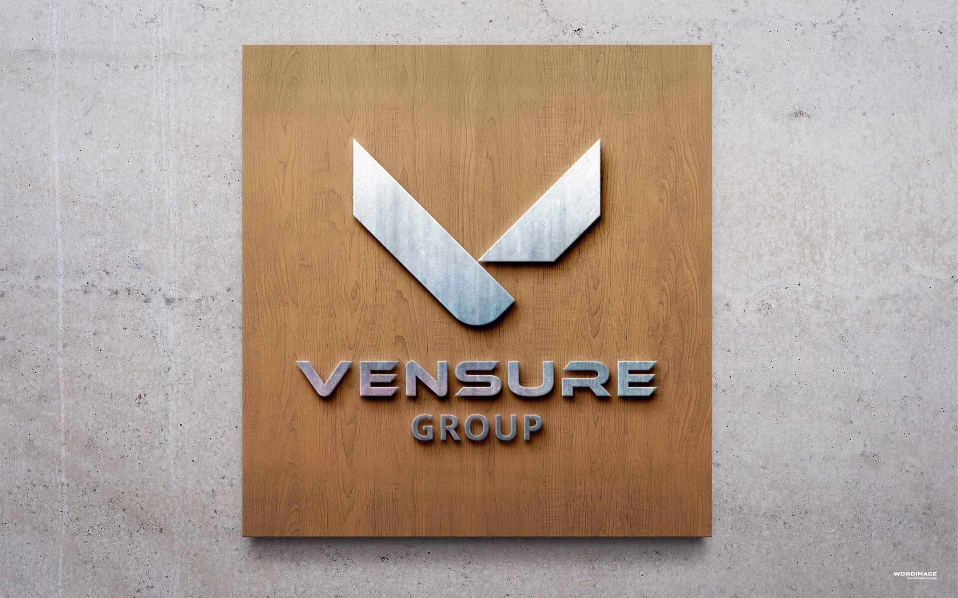 A wooden sign that says ' vensure group ' on it
