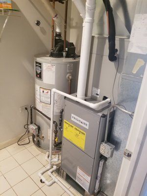 There is a water heater and a furnace in the basement.