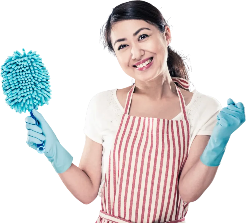 Woman in apron and gloves, smiling, holding a blue duster.