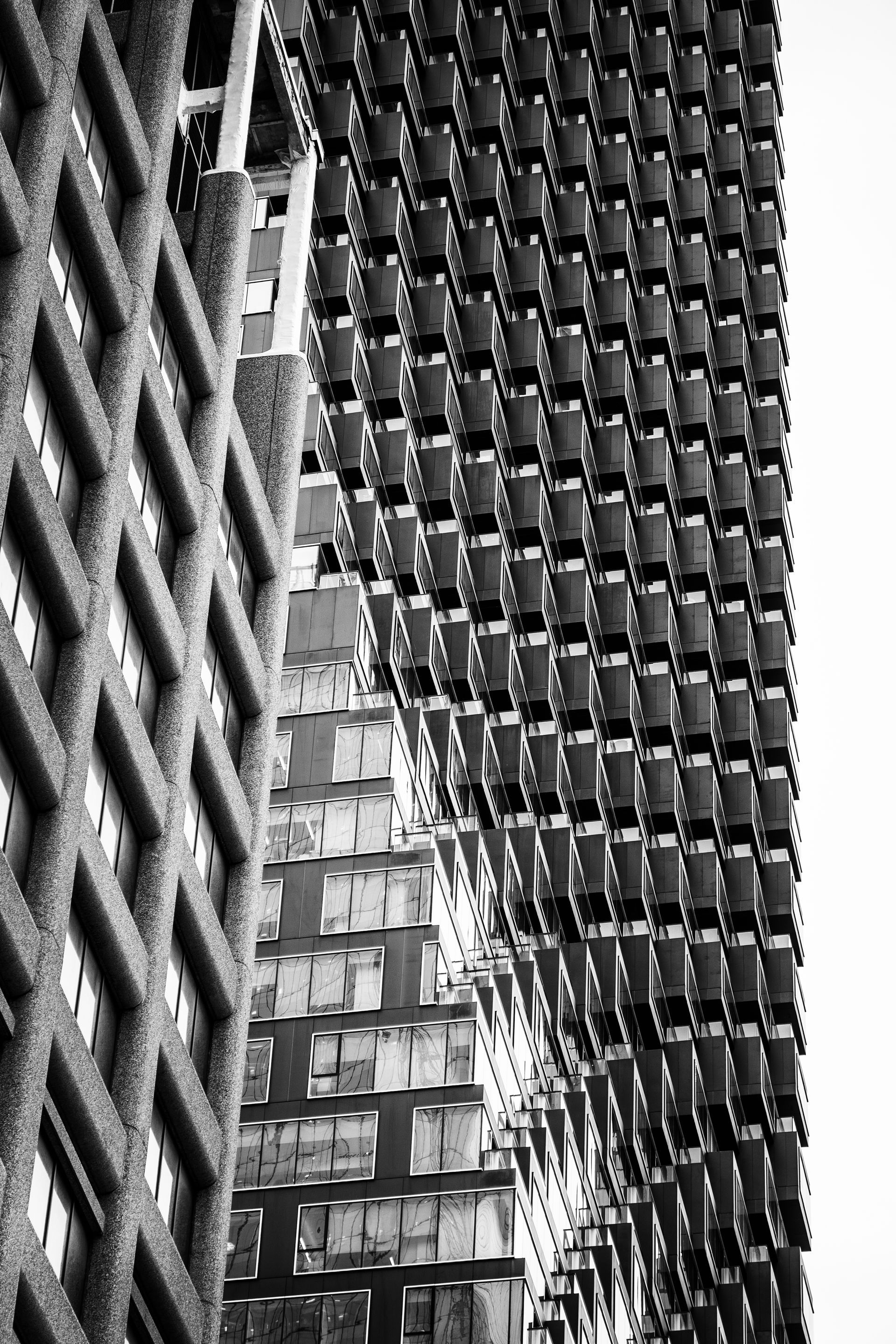 Abstract, black and white shot of modern building facades with patterned textures.