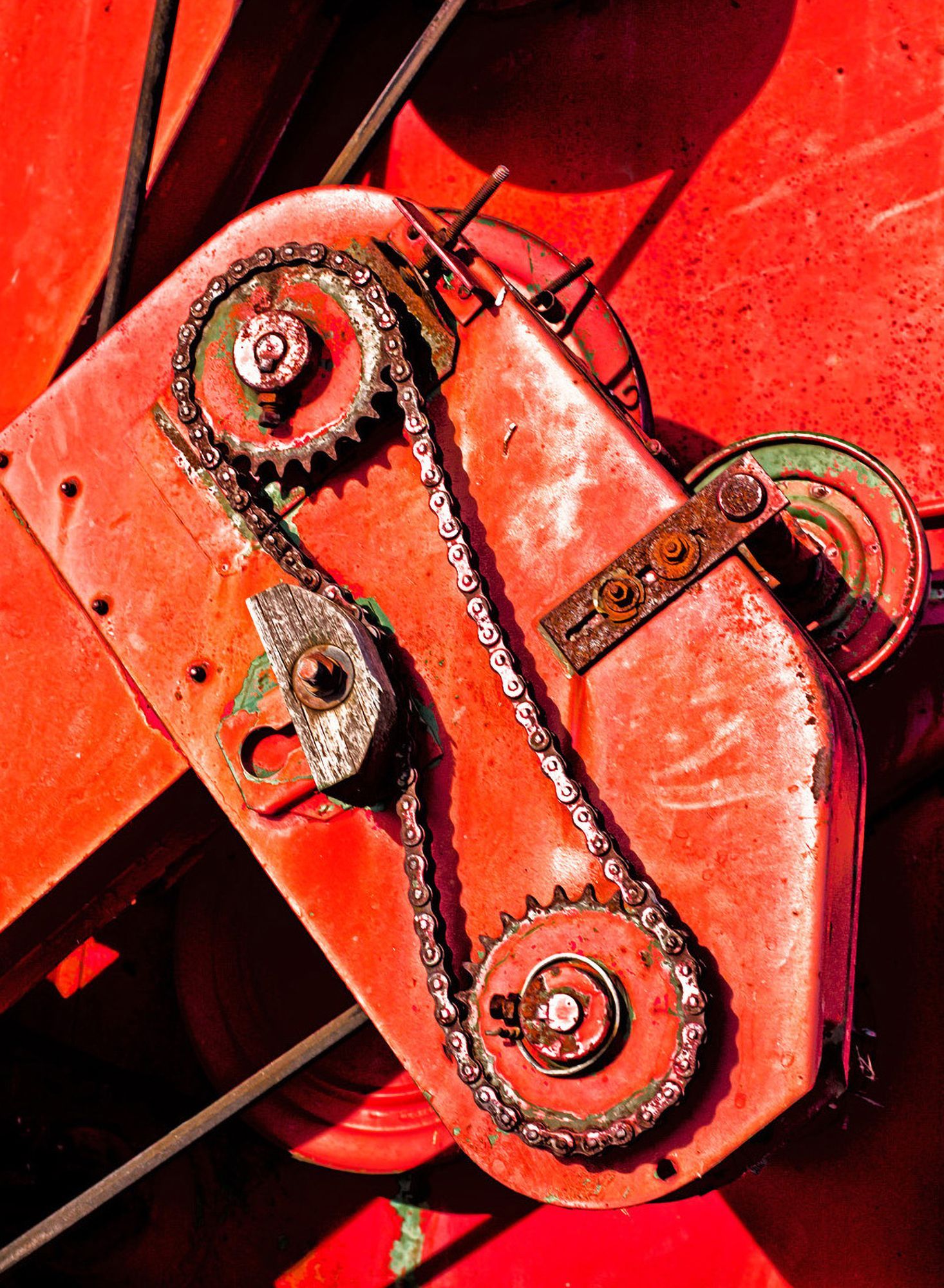 Red machinery with chains and gears.