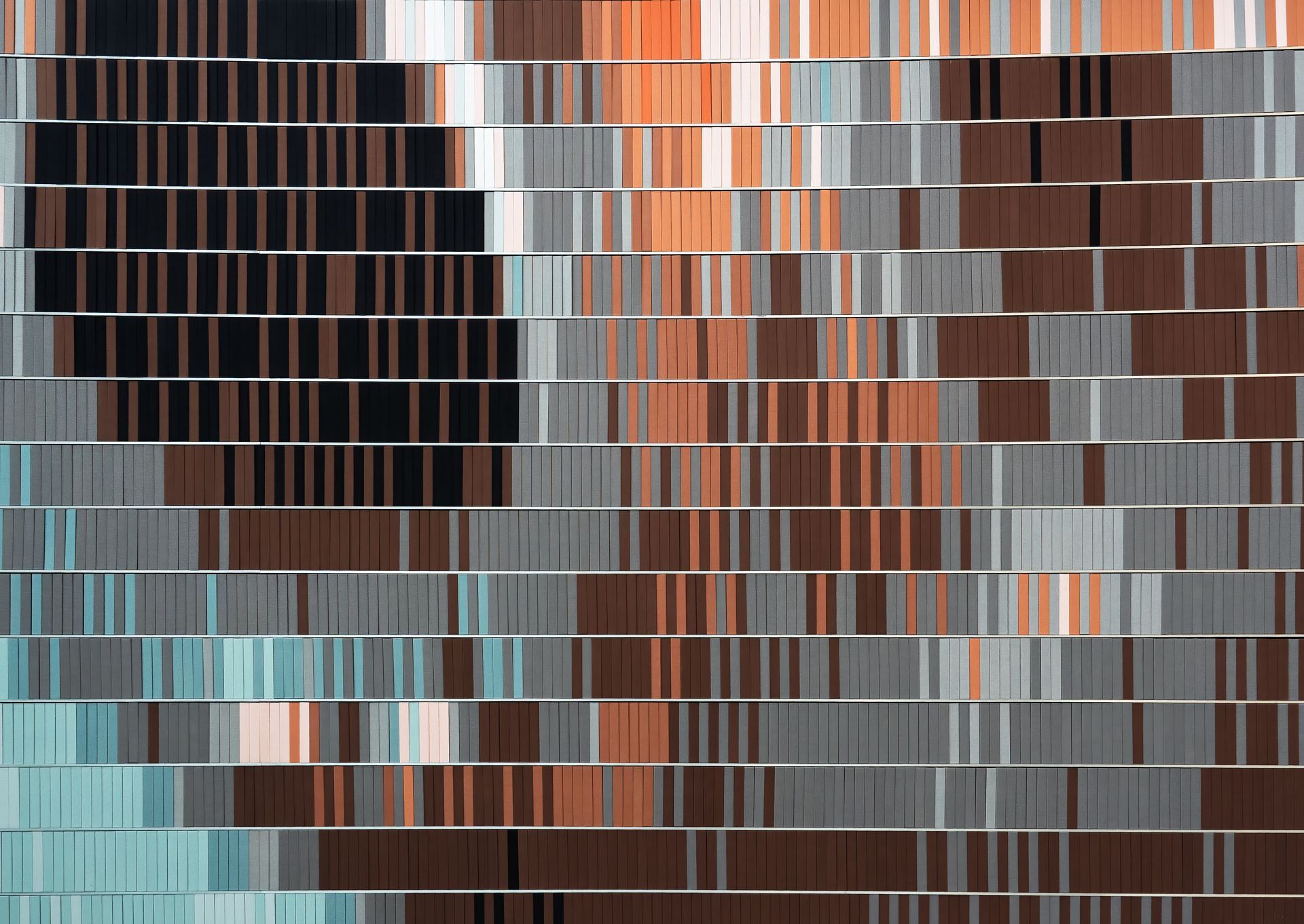 Abstract artwork with stacked, horizontal blocks in shades of blue, orange, brown, and grey.