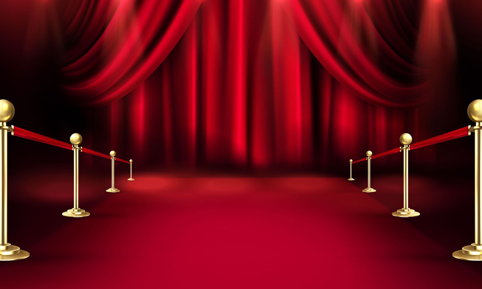 Red carpet entrance with velvet rope barriers, gold stanchions, and red curtains.