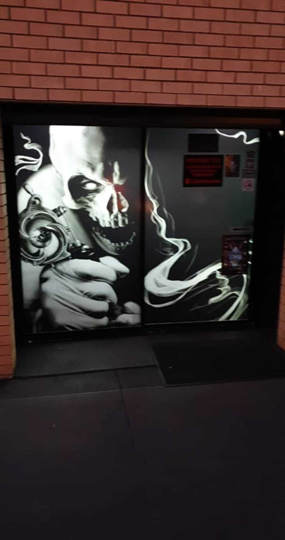 Glass Door with Skull Art — Premium Window Films in South Lismore, NSW