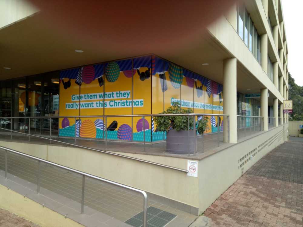 Shop With Custom Sign In Windows — Premium Window Films in South Lismore, NSW