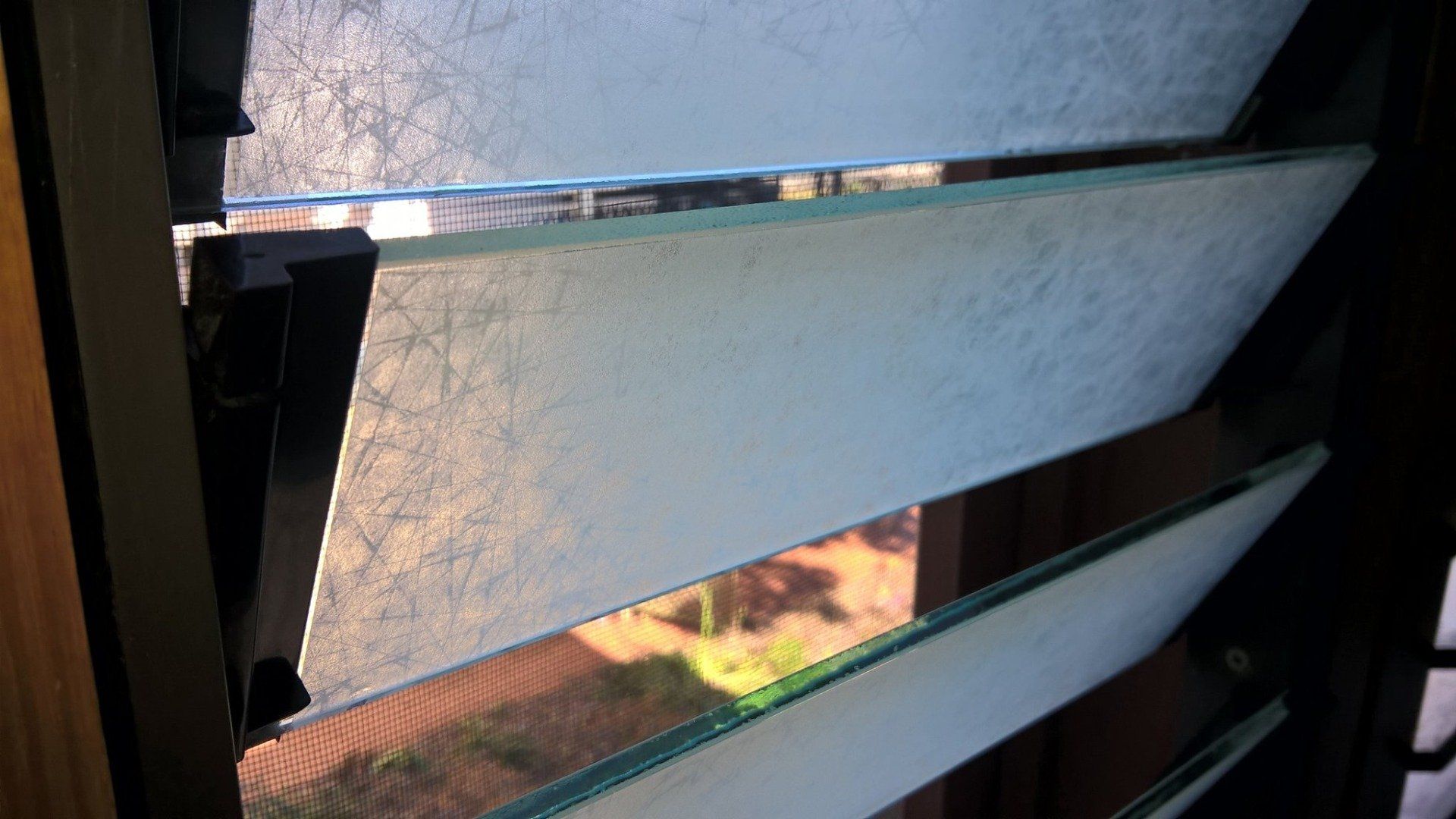 Jalousie Window with Film — Darkstyle Tinting in South Lismore, NSW