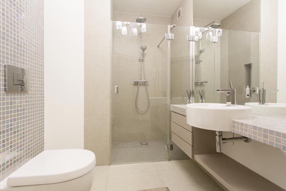 Small Renovated Bathroom With Floating Vanity And Big Mirror