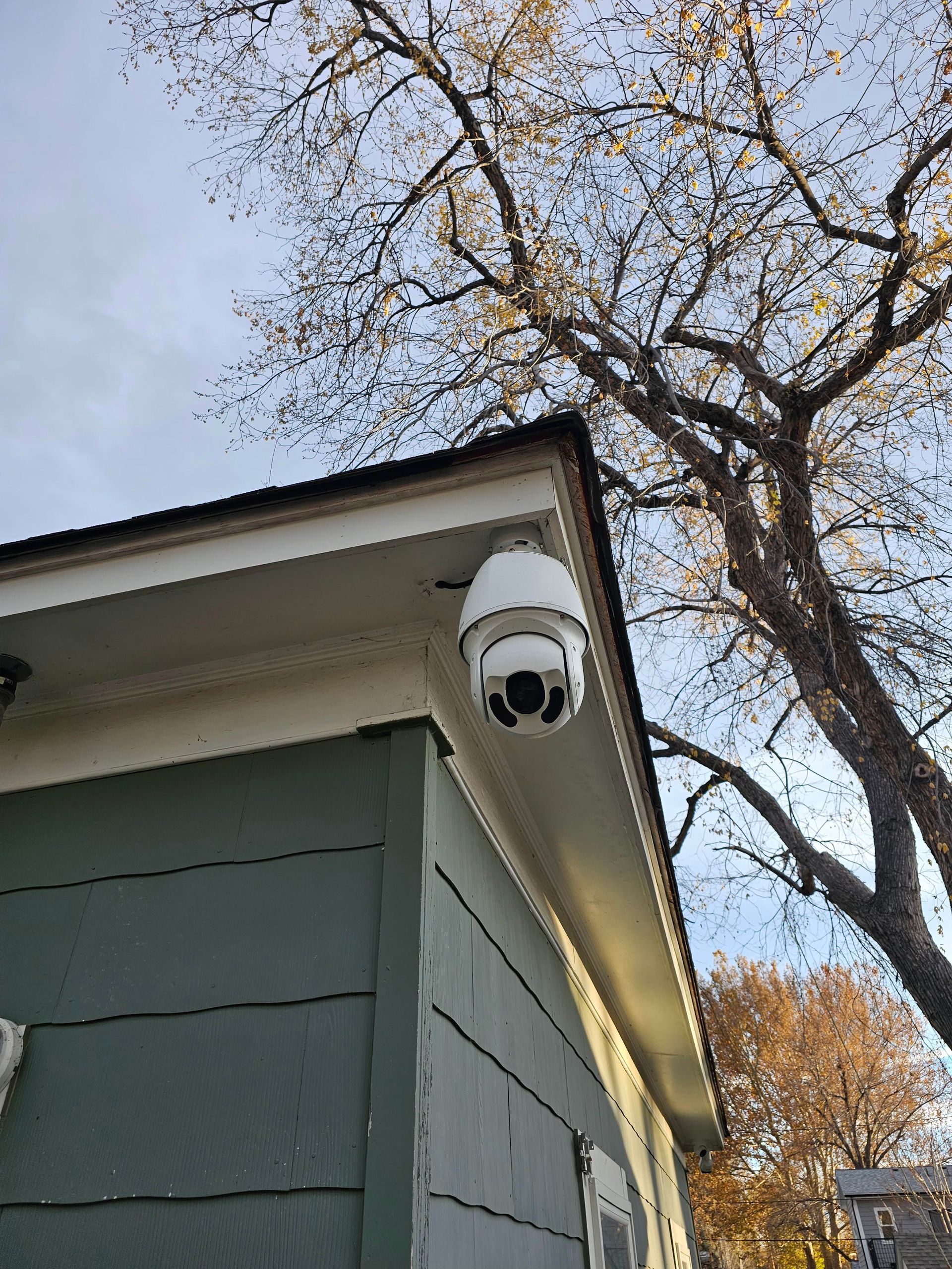 Yellow electrical box with circuit board, wiring, and documentation inside a white enclosure.