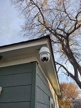 Yellow electrical box with circuit board, wiring, and documentation inside a white enclosure.