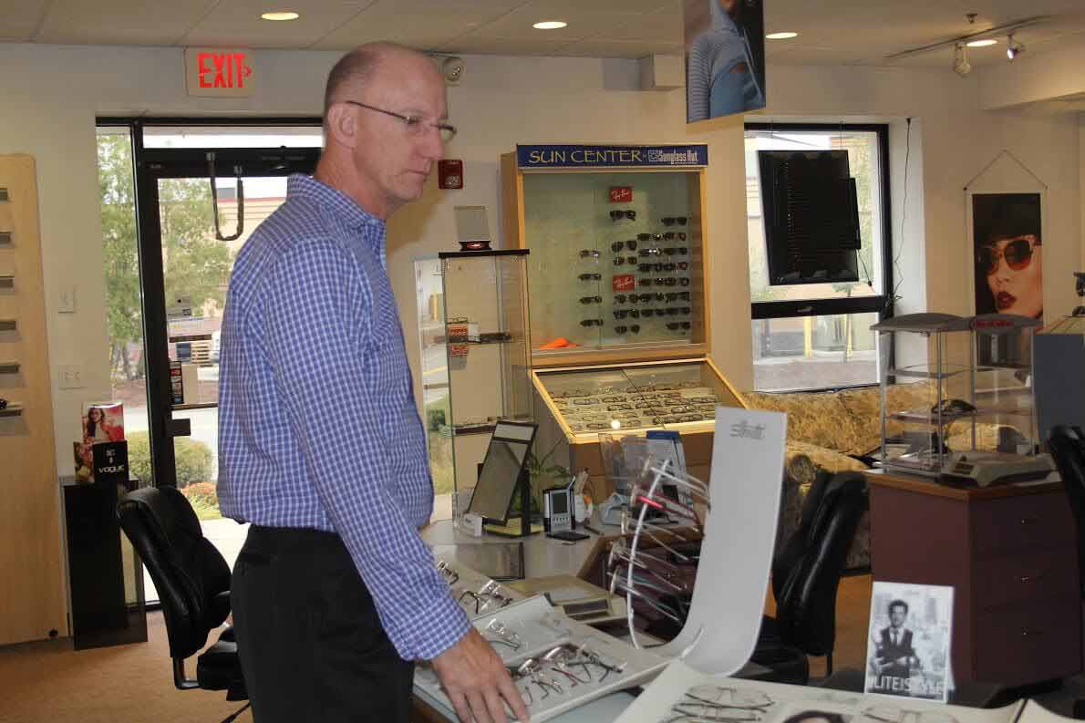 Men choosing eyeglasses — Eye Care Center In Brockton, Ma Men choosing eyeglasses — Eye Care Center In Brockton, Ma