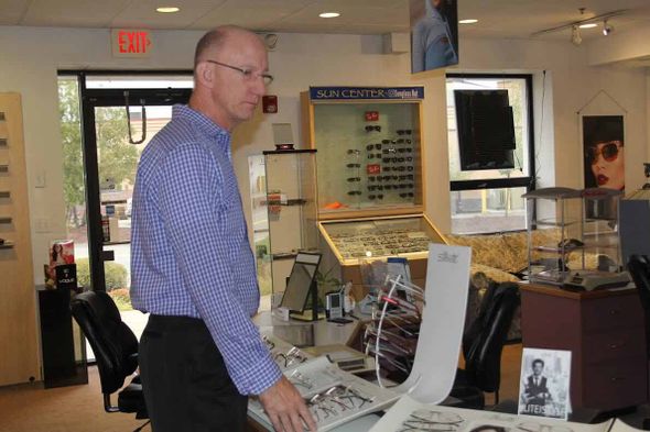 Men choosing eyeglasses — Eye Care Center In Brockton, Ma
