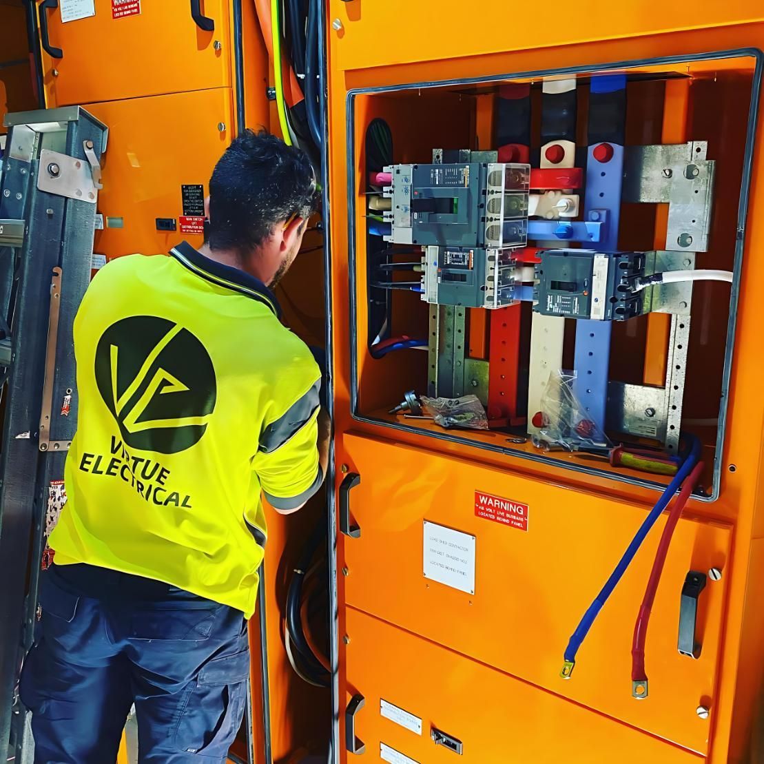 A Man Working on an Electrical Panel