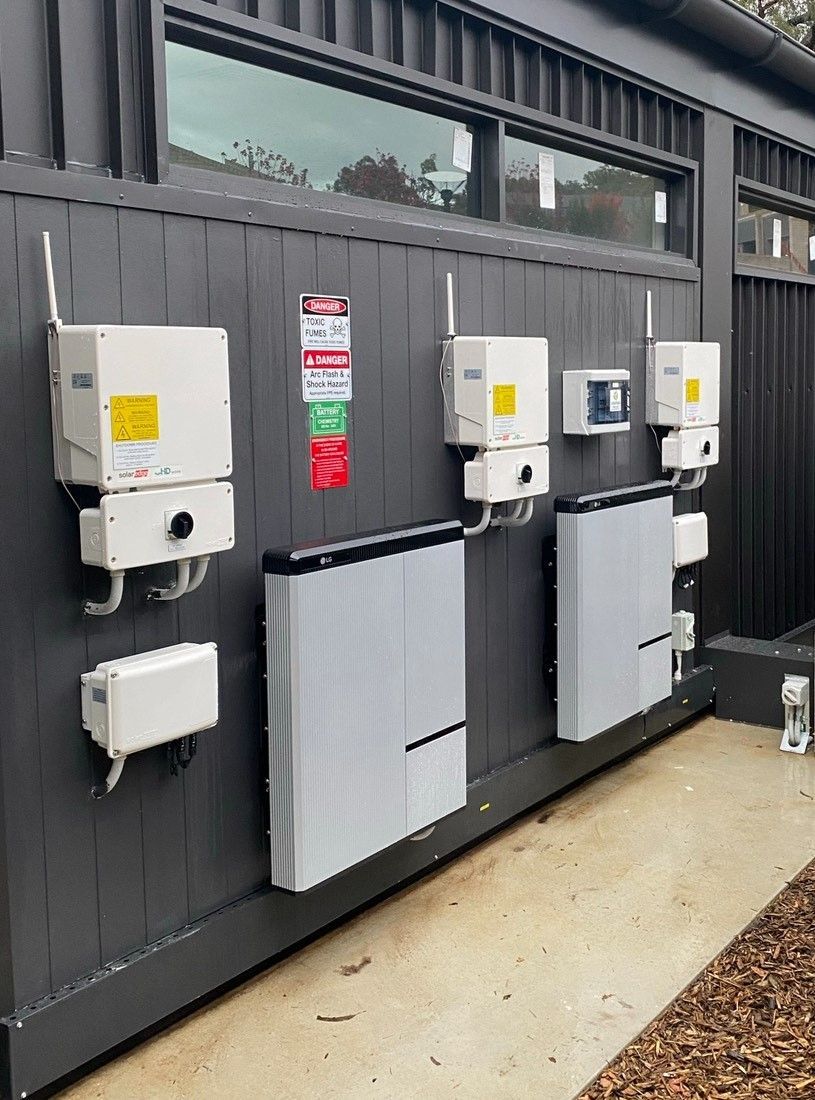 Solar Storage Batteries On Outside Wall  — Electrical Services in Beard, ACT