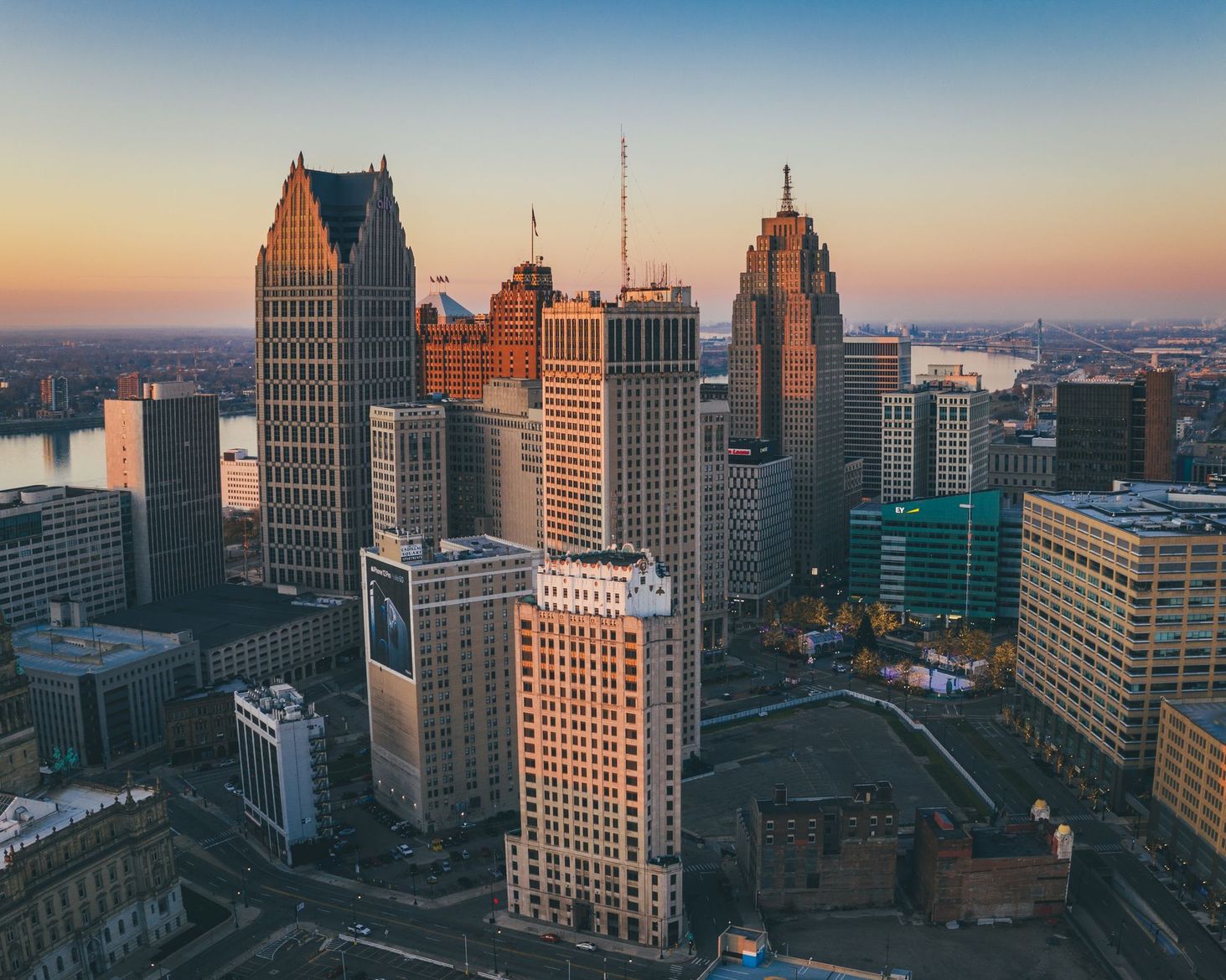 An aerial view of a city skyline at sunset.