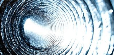 A close up of a metal pipe with a light at the end.