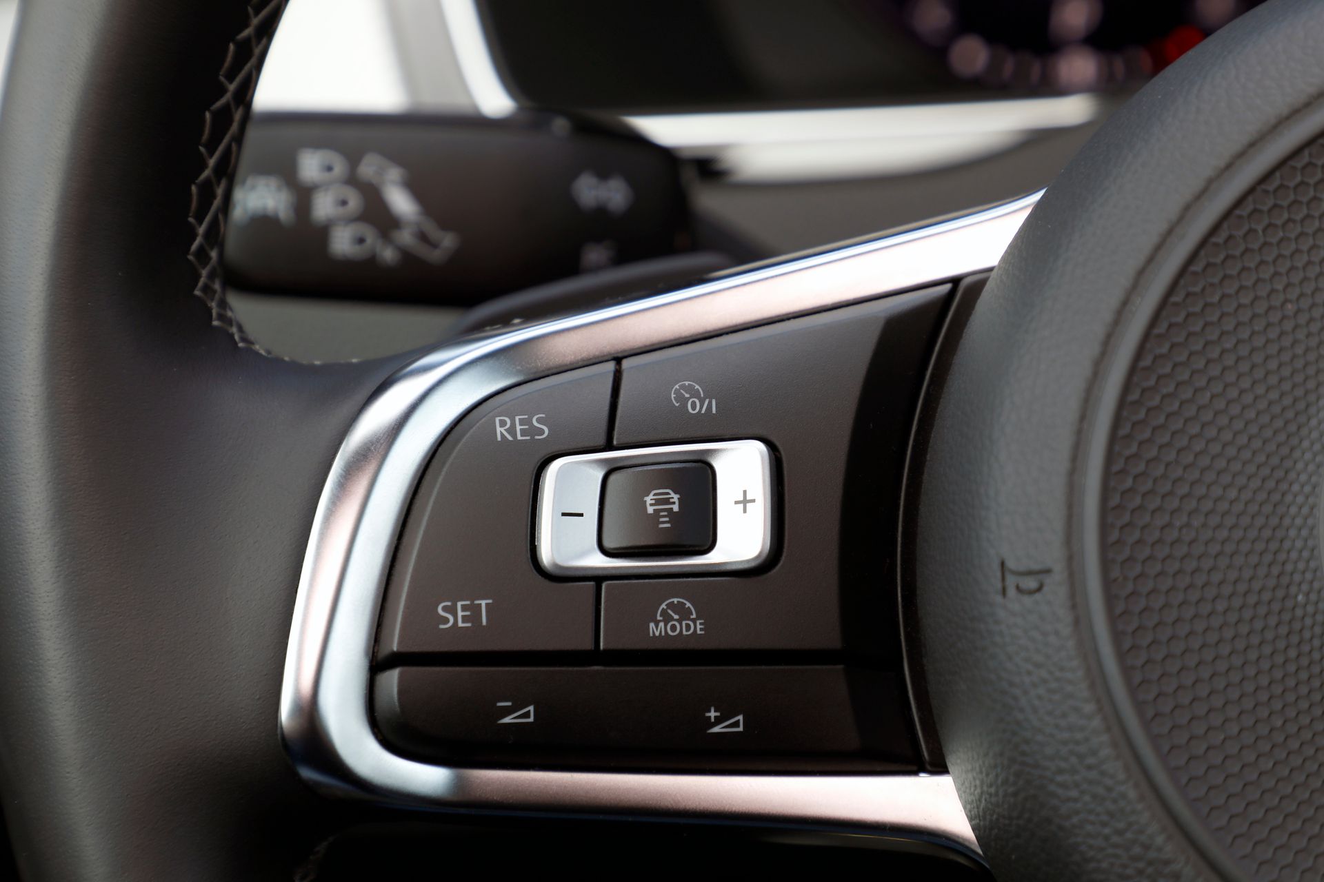 A close up of the steering wheel of a car