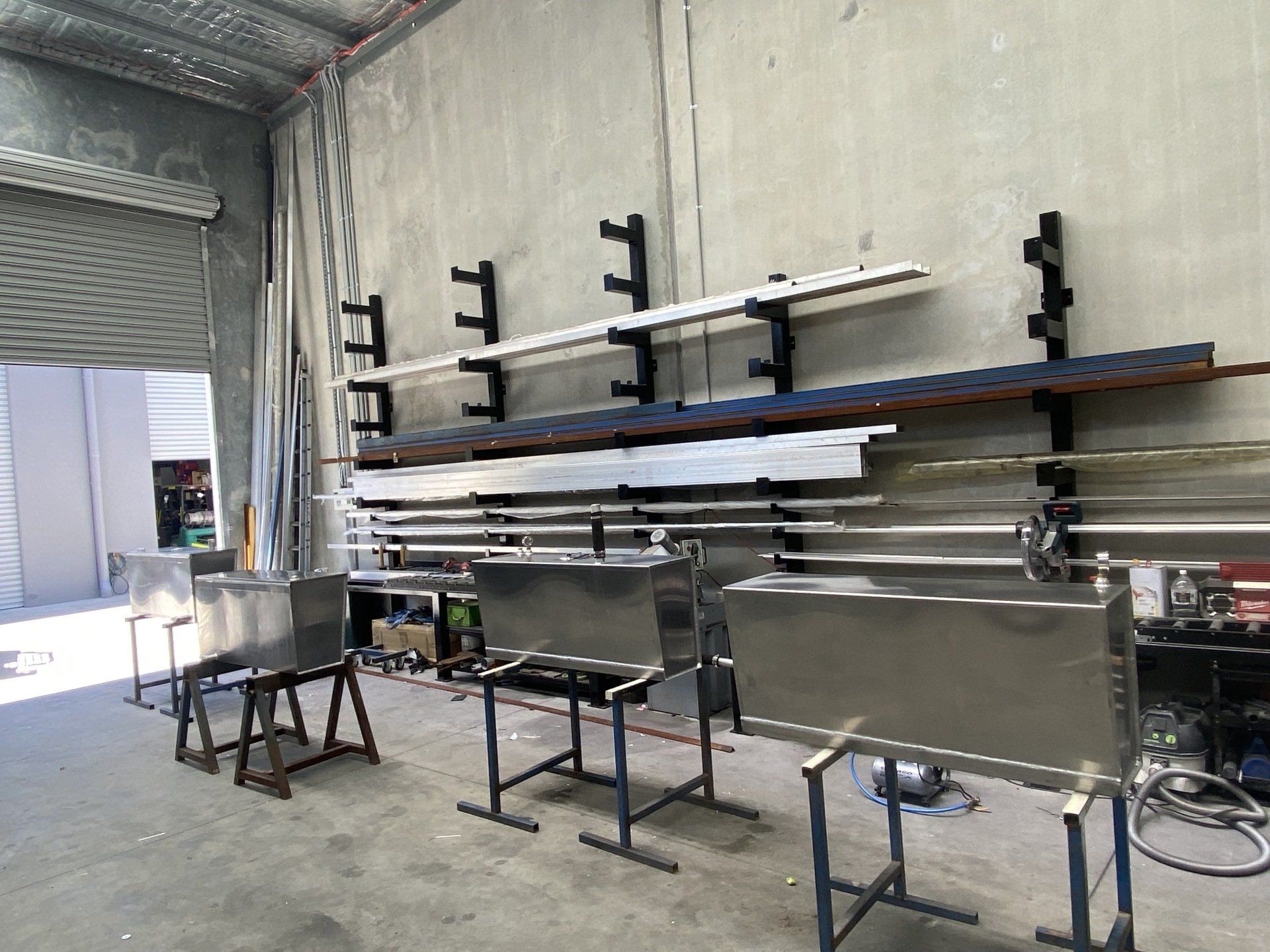 Metal Works Sheets Display on Wall — Aluminium & Steel Fabrication in Somersby, NSW