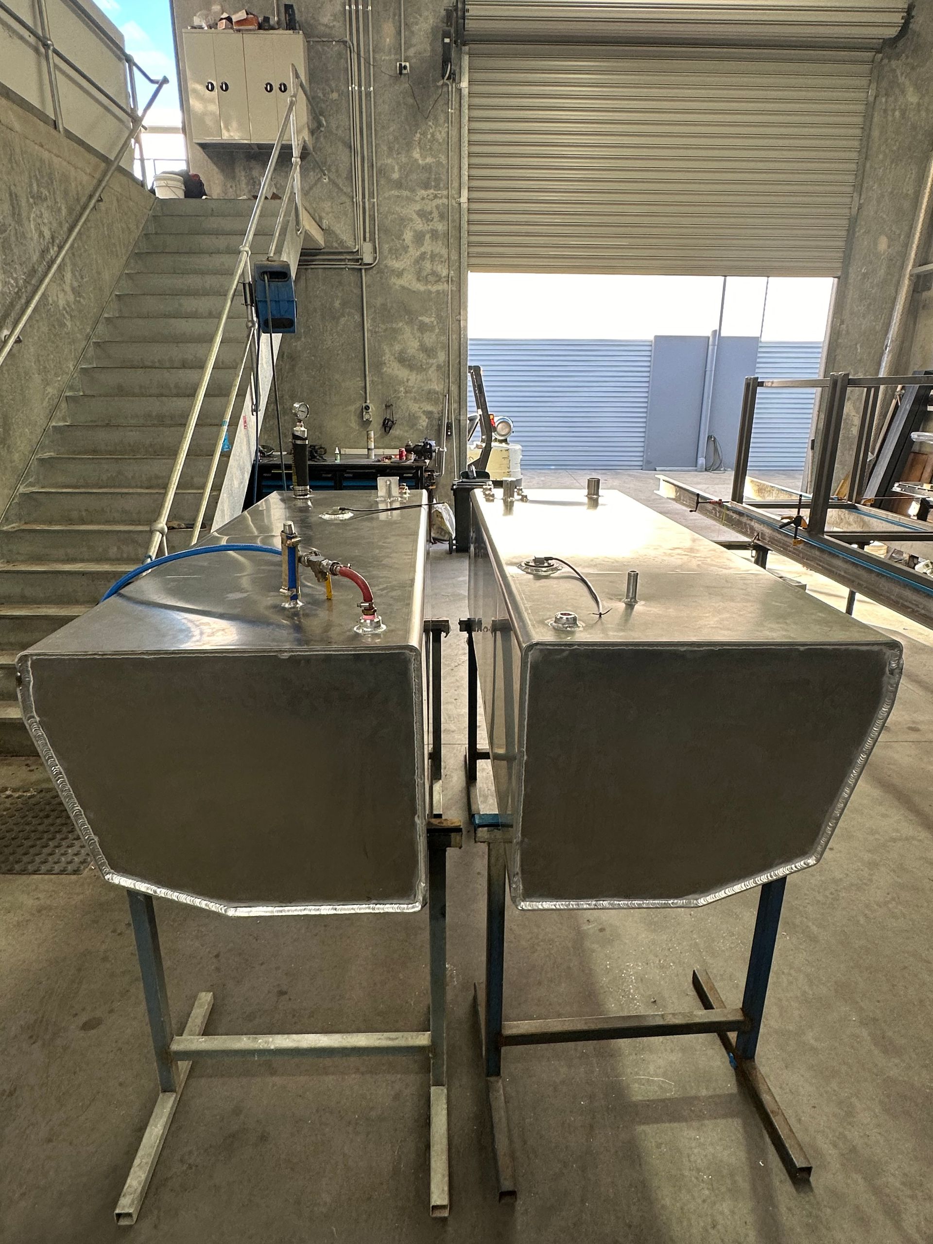 A Stainless Steel Tank is Sitting on a Table in a Warehouse — EB Metalworks in Gosford, NSW