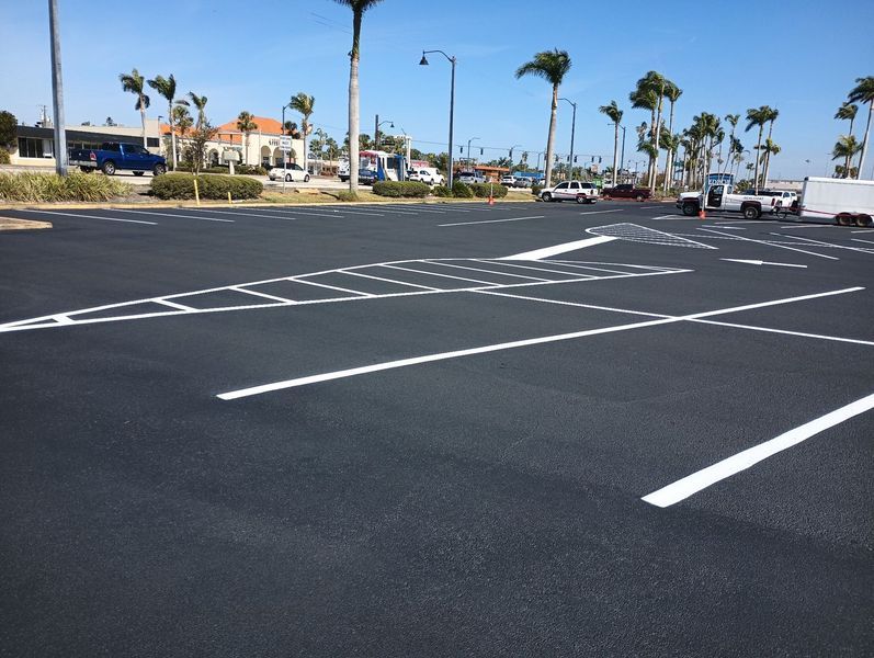 An empty parking lot with white lines on it