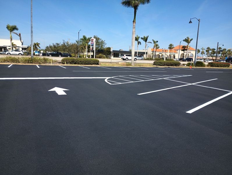 A parking lot with an arrow pointing to the right