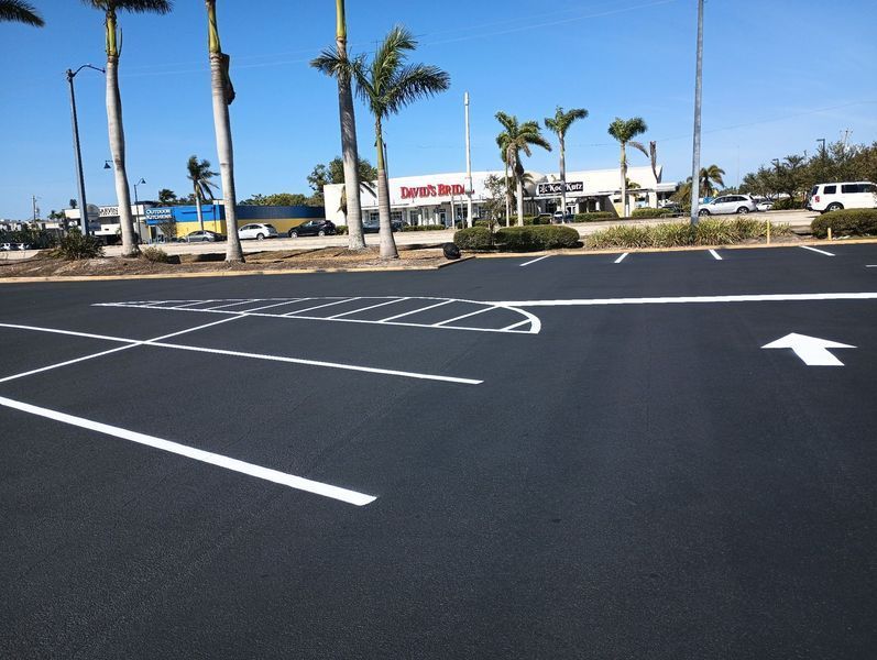 A parking lot with an arrow pointing to the right
