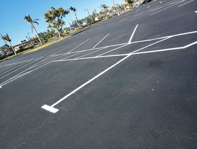 An empty parking lot with white lines on it