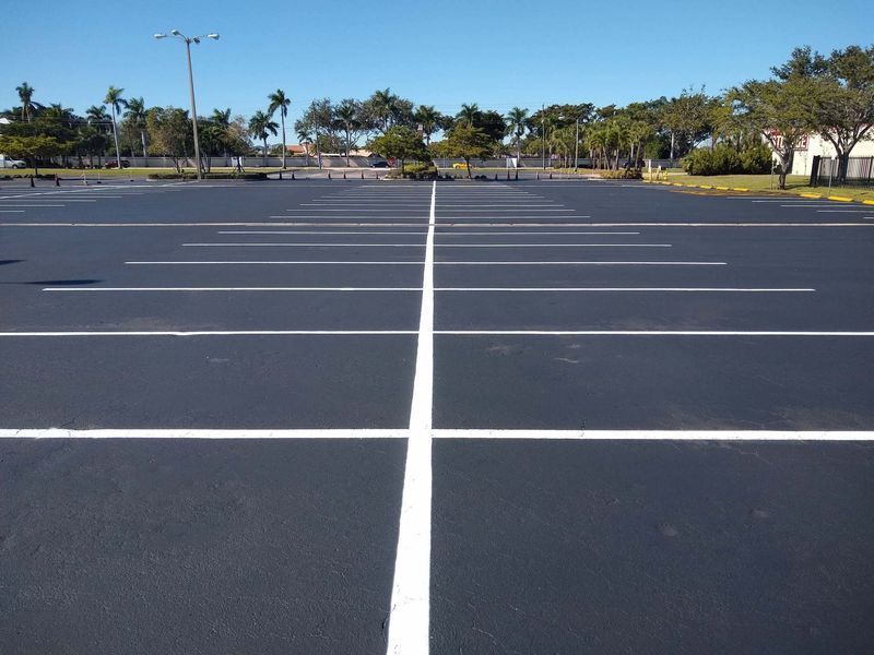 A parking lot with a white line in the middle