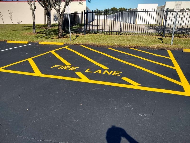 A parking lot has a fire lane painted on it