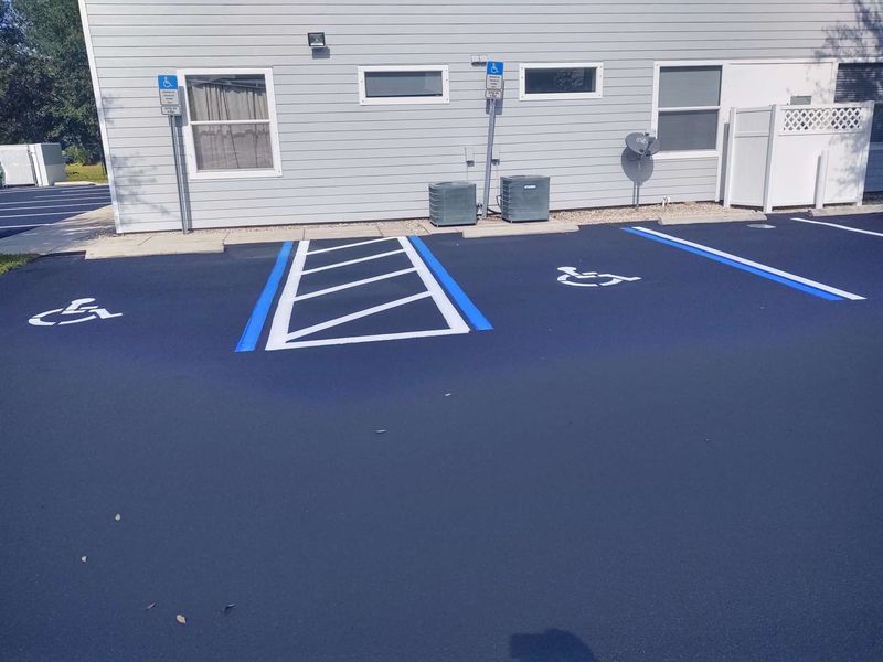 A handicapped parking spot in front of a building.