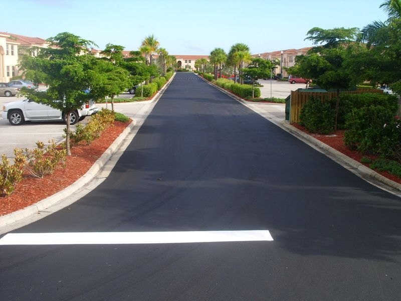 A car is parked on the side of a road