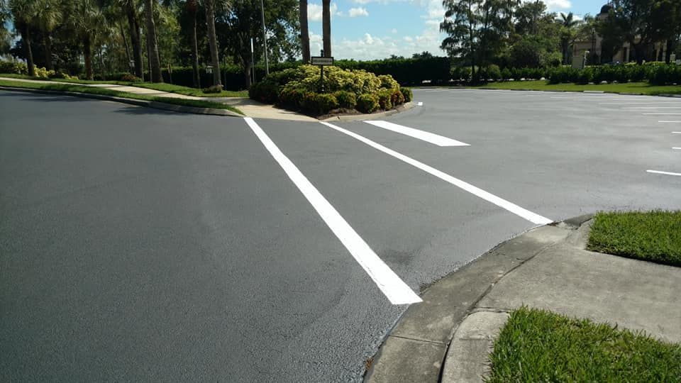 A parking lot with two white lines painted on it