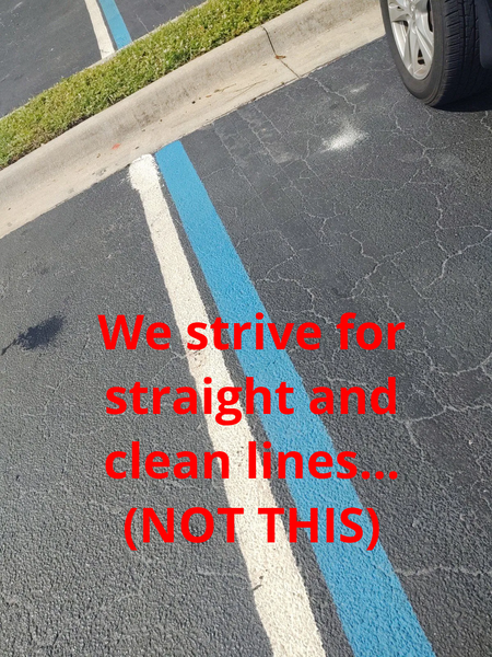 A sign that says we strive for straight and clean lines