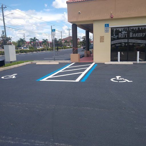 A handicapped parking spot in front of a bakery