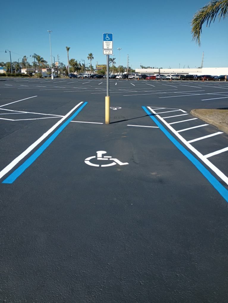 A handicapped parking spot in a parking lot