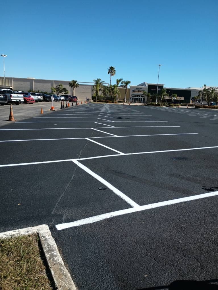 A parking lot with a building in the background