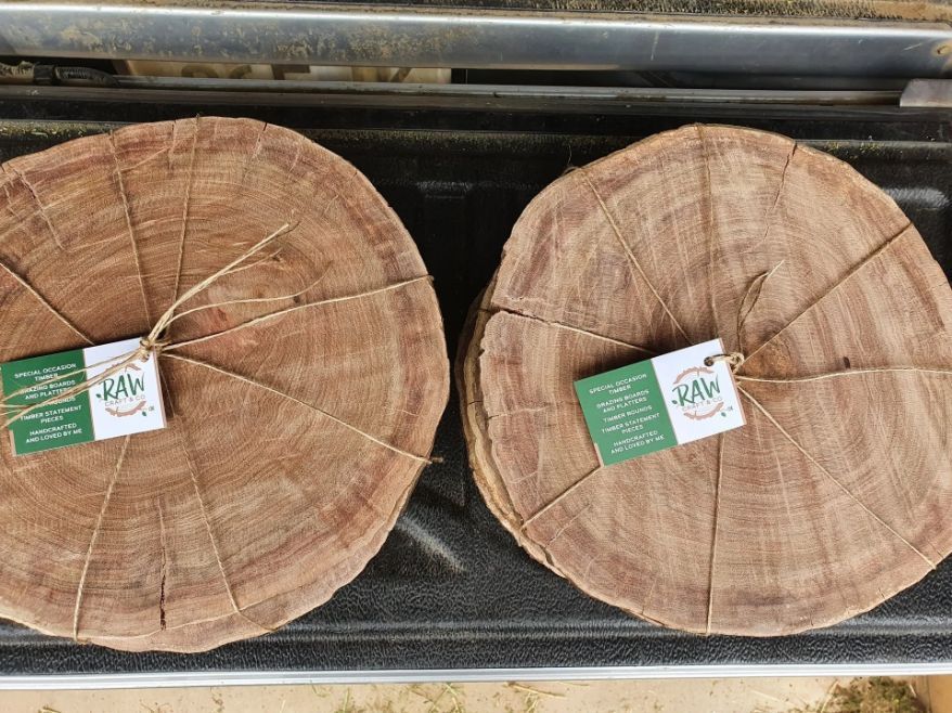 Two Pieces of Wood Are Sitting on Top of Each Other on A Table — CK's Milling & Earthworks in Bells Bridge, QLD