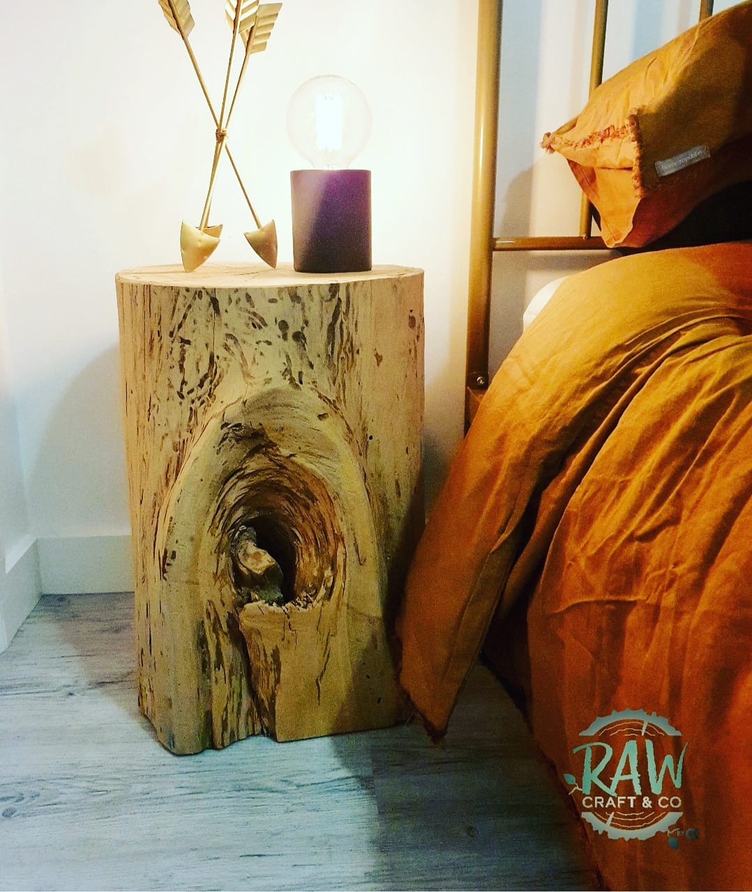 A Wooden Stump with A Hole in It Sits Next to A Bed — CK's Milling & Earthworks in Bells Bridge, QLD