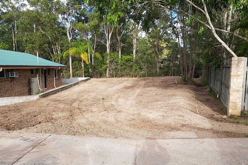 A Dirt Road Leading to A House with Trees in The Background — CK's Milling & Earthworks in Bells Bridge, QLD