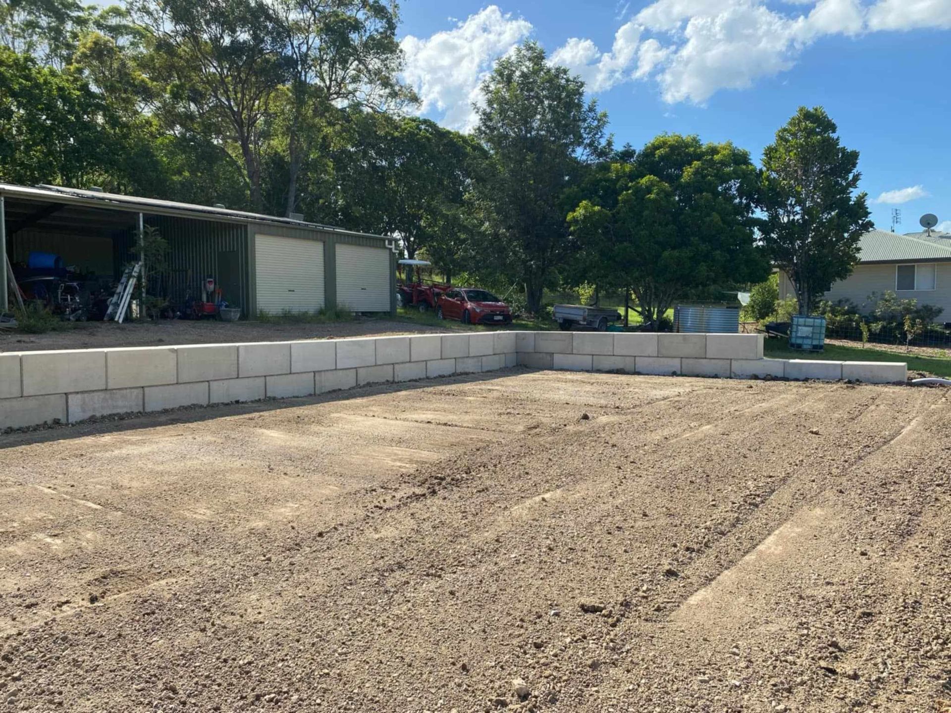Low Stone Wall Beside Even Dirt Surface — CK's Milling & Earthworks in Bells Bridge, QLD